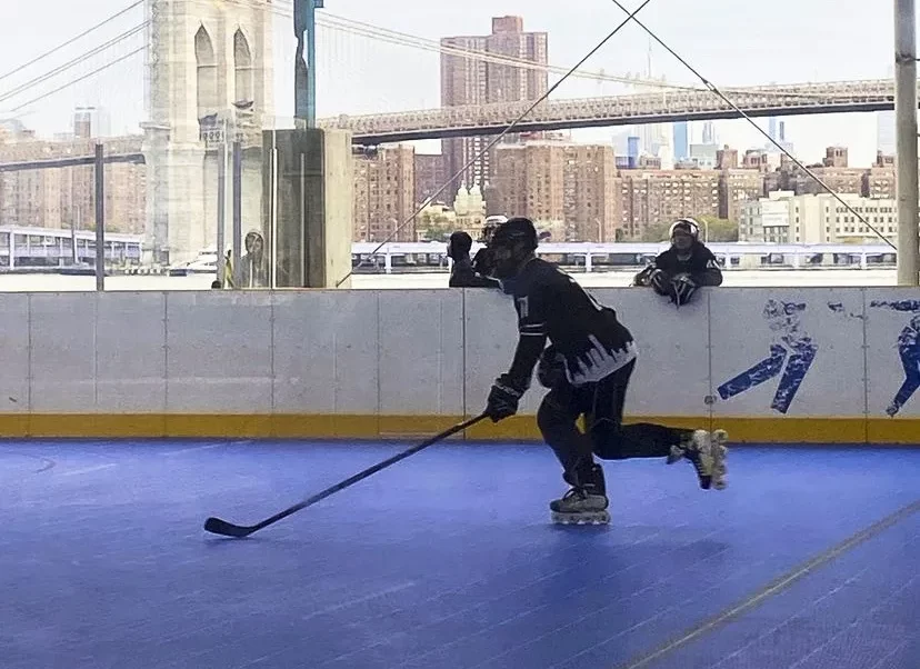 hockey player skating with stick